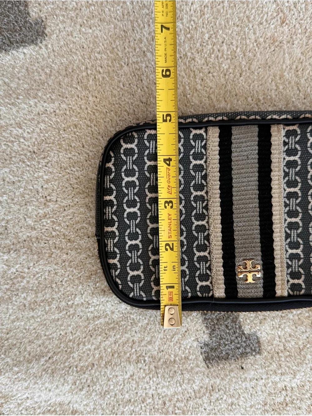 Tory Burch Black and Tan Patterned Logo Wristlet with Stripe Detail
